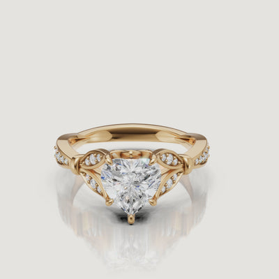 Rotating video of Raul Diamonds heart cut lab grown diamond engagement ring in 14K yellow gold with pavé accents
