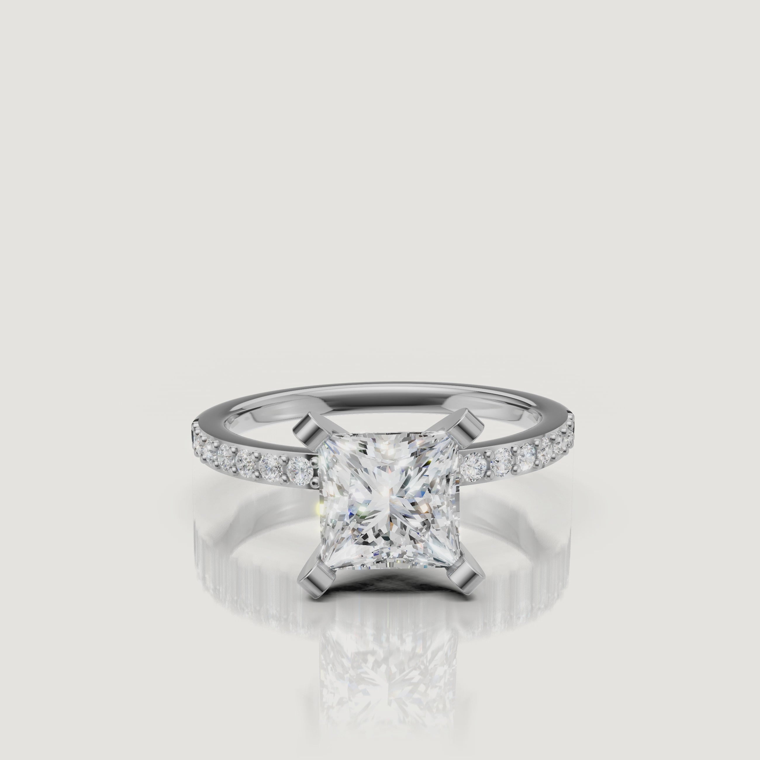 High-definition video of the Raul Diamonds white gold princess cut solitaire with a pavé-set diamond band, demonstrating exceptional sparkle and modern luxury design.