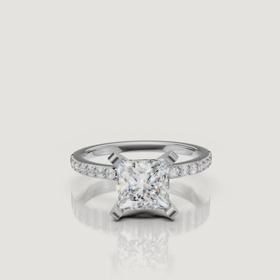High-definition video of the Raul Diamonds white gold princess cut solitaire with a pavé-set diamond band, demonstrating exceptional sparkle and modern luxury design.