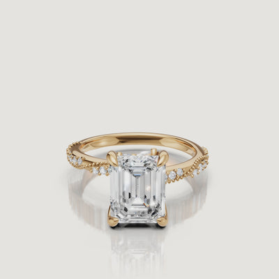 14K yellow gold emerald cut lab grown diamond engagement ring with twisted pavé band and hall of mirrors sparkle by Raul Diamonds
