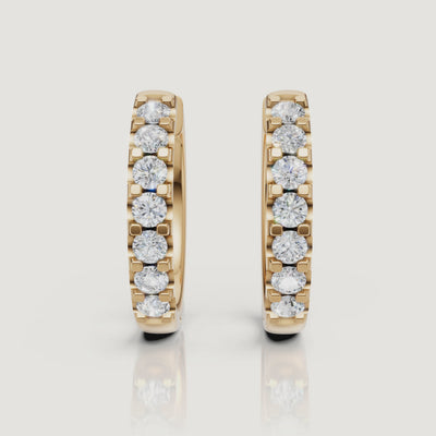 Yellow gold diamond hoop earrings video showcasing brilliant pave sparkle by Raul Diamonds