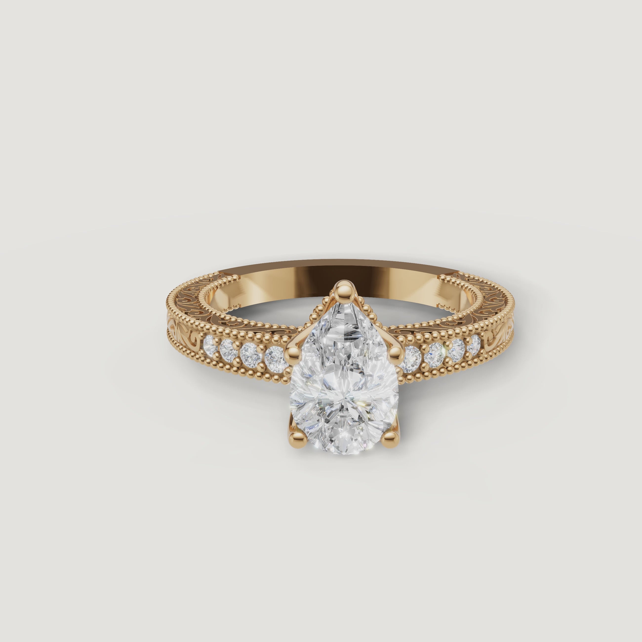 360 video of vintage pear cut lab grown diamond engagement ring in 14K yellow gold with ornate milgrain detailing by Raul Diamonds.
