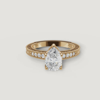 360 video of vintage pear cut lab grown diamond engagement ring in 14K yellow gold with ornate milgrain detailing by Raul Diamonds.