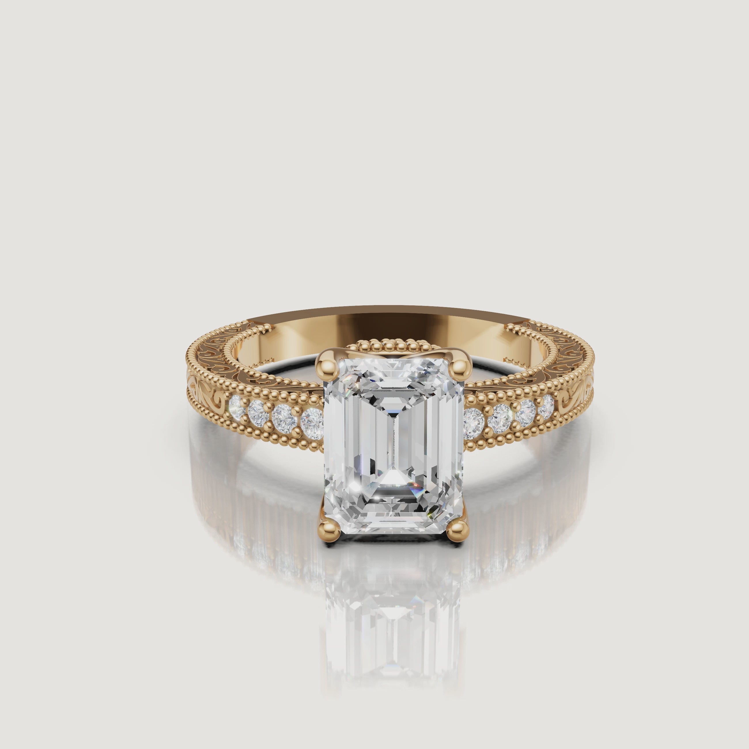 360 video of vintage emerald cut lab grown diamond engagement ring in 14K yellow gold with ornate filigree detailing by Raul Diamonds.