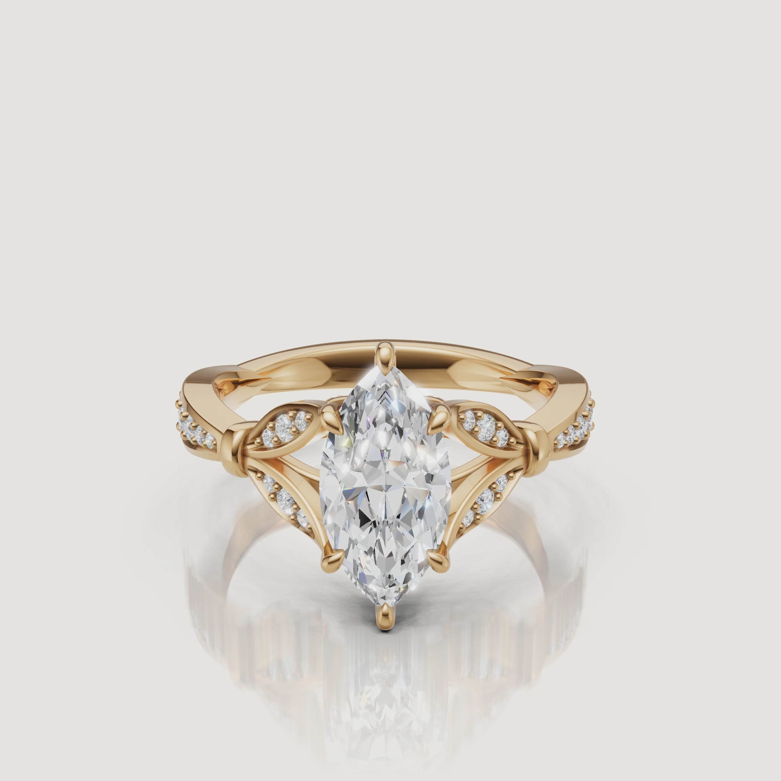 Rotating video of Raul Diamonds marquise cut lab grown diamond engagement ring in 14K yellow gold with pavé accents
