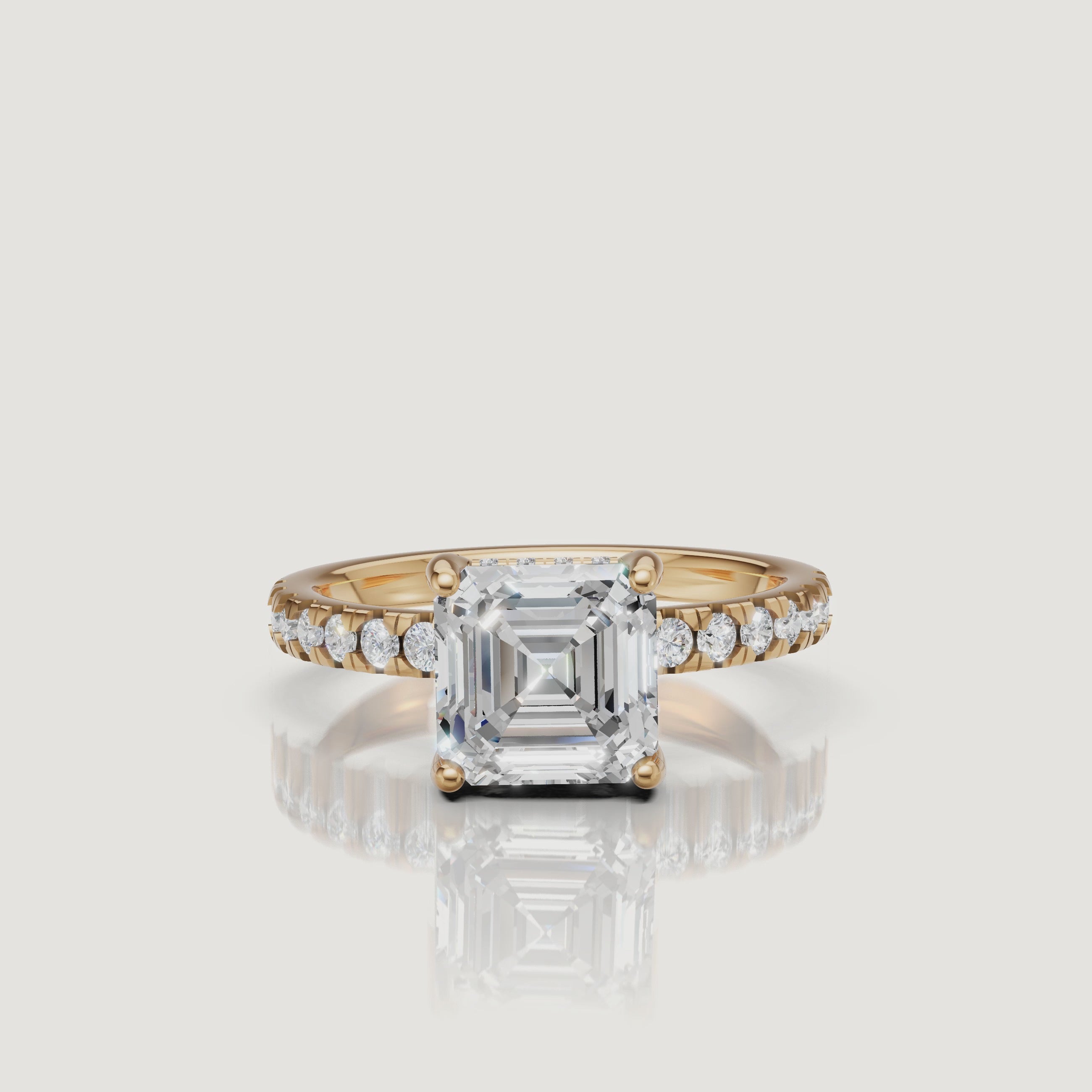 360-degree video showcase of a Raul Diamonds Asscher cut engagement ring in 18k yellow gold, featuring a brilliant pave diamond band and high-polish finish