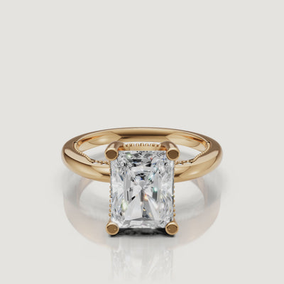 Cinematic 4K video of a Raul Diamonds radiant cut ring in yellow gold, demonstrating the 'crushed ice' sparkle and warm 18k gold glow