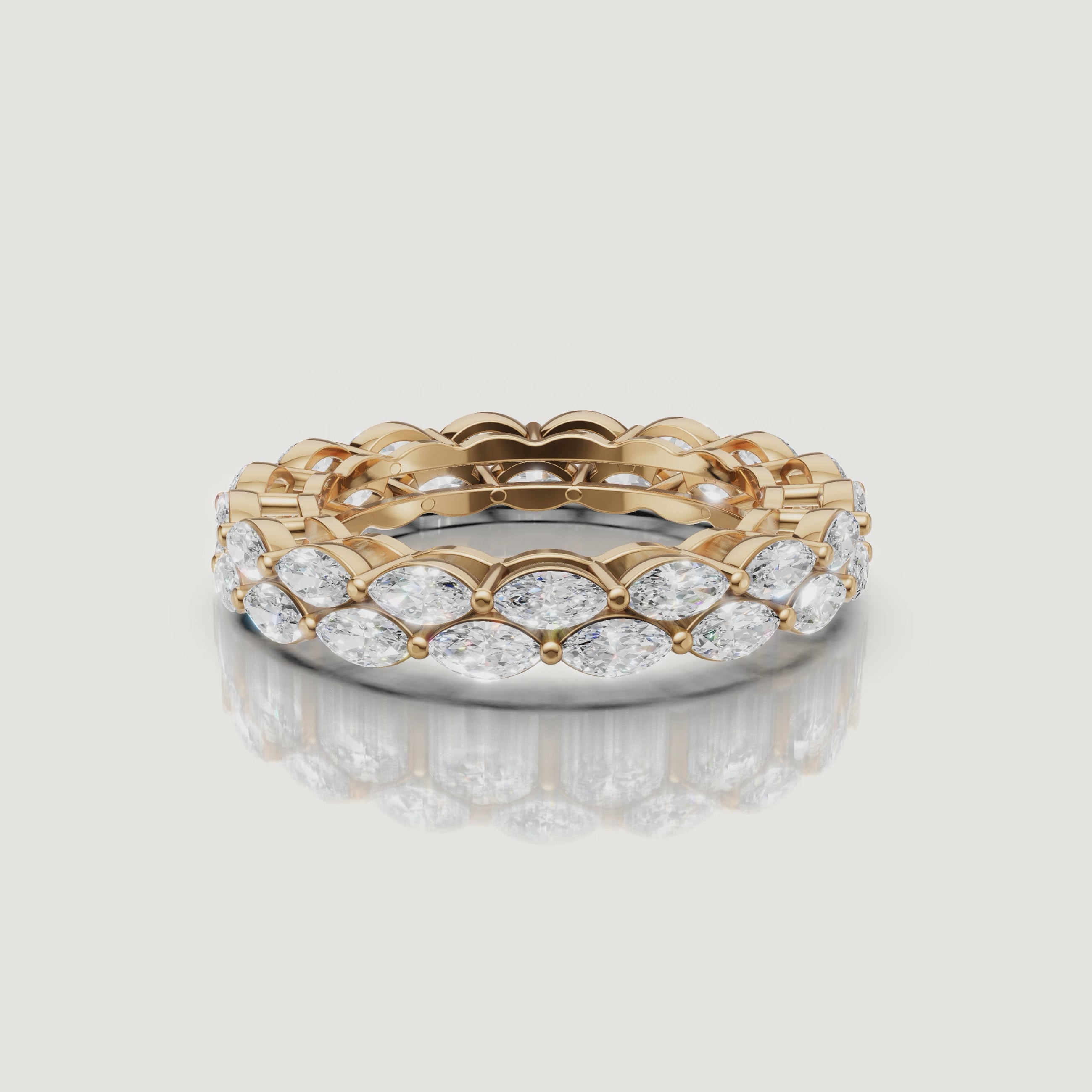rotating view of marquise cut lab grown diamond eternity band in polished 14k gold