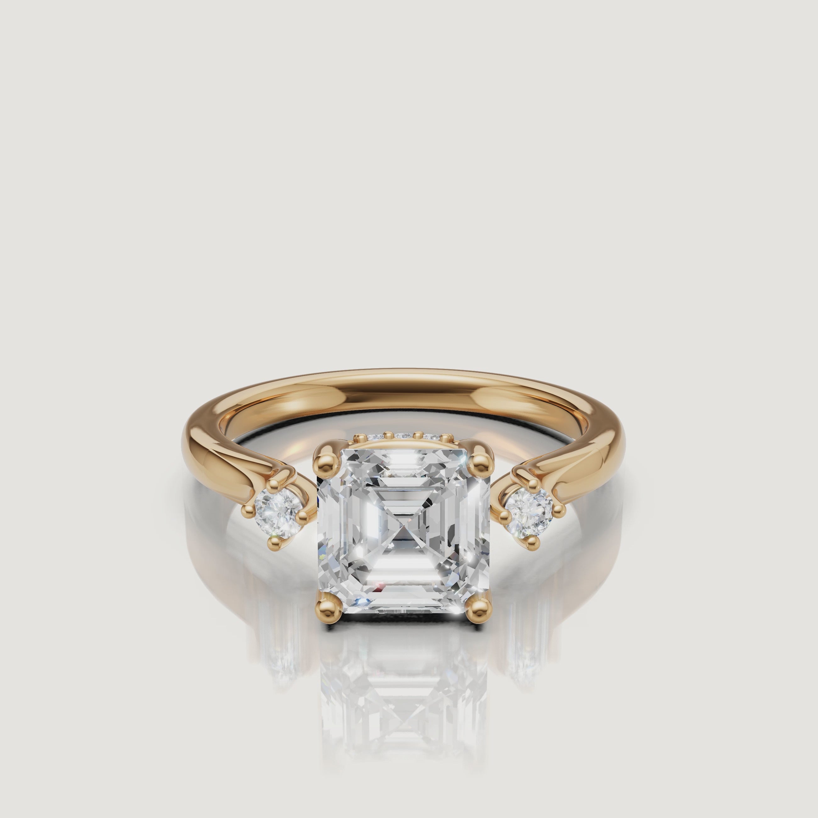 14K yellow gold asscher cut lab grown diamond engagement ring with round side stones by Raul Diamonds