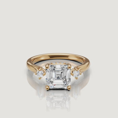 14K yellow gold asscher cut lab grown diamond engagement ring with round side stones by Raul Diamonds