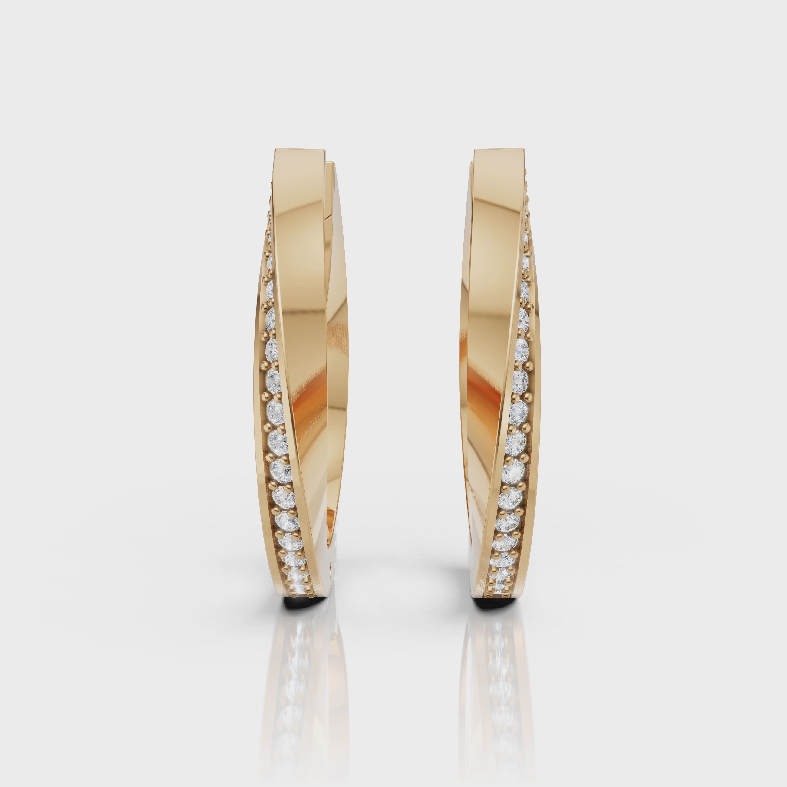 Yellow gold pavé diamond hoop earrings video showcasing brilliant sparkle, elegant movement, and luxury fine jewelry styling by Raul Diamonds