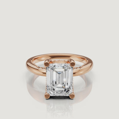 Macro video of a white gold emerald cut solitaire ring from Raul Diamonds, displaying the sharp geometric lines and brilliant white light performance.