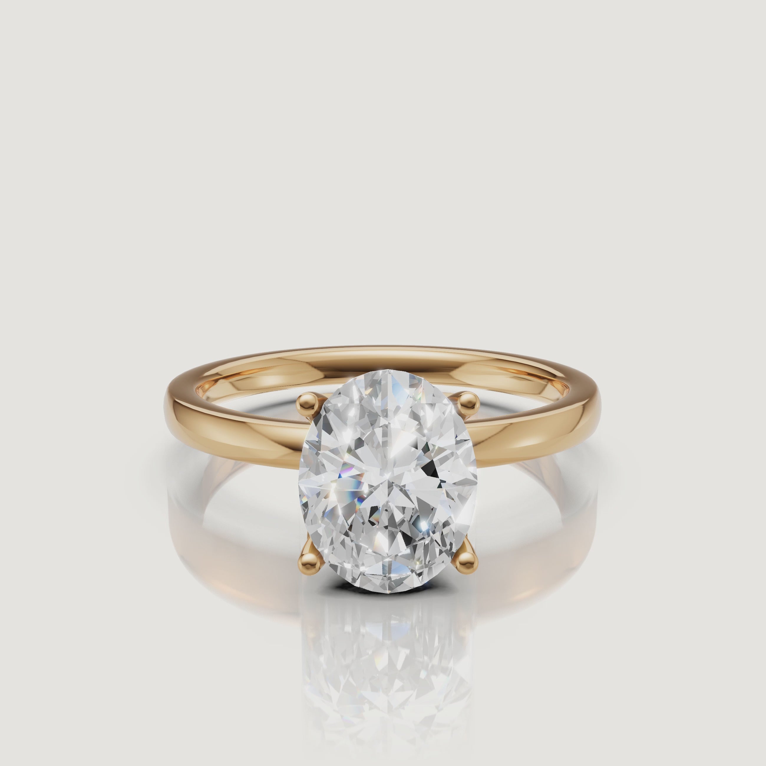 High-definition product video of a Raul Diamonds oval cut solitaire ring in yellow gold, featuring the brilliant sparkle and classic four-prong gold setting
