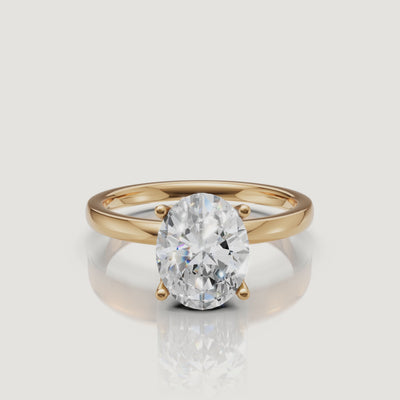 High-definition product video of a Raul Diamonds oval cut solitaire ring in yellow gold, featuring the brilliant sparkle and classic four-prong gold setting