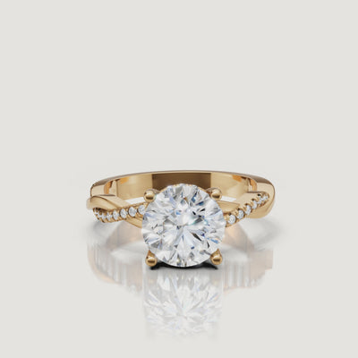 video of round brilliant lab grown diamond bypass engagement ring in 14k gold with pavé crossover shank and timeless sparkle