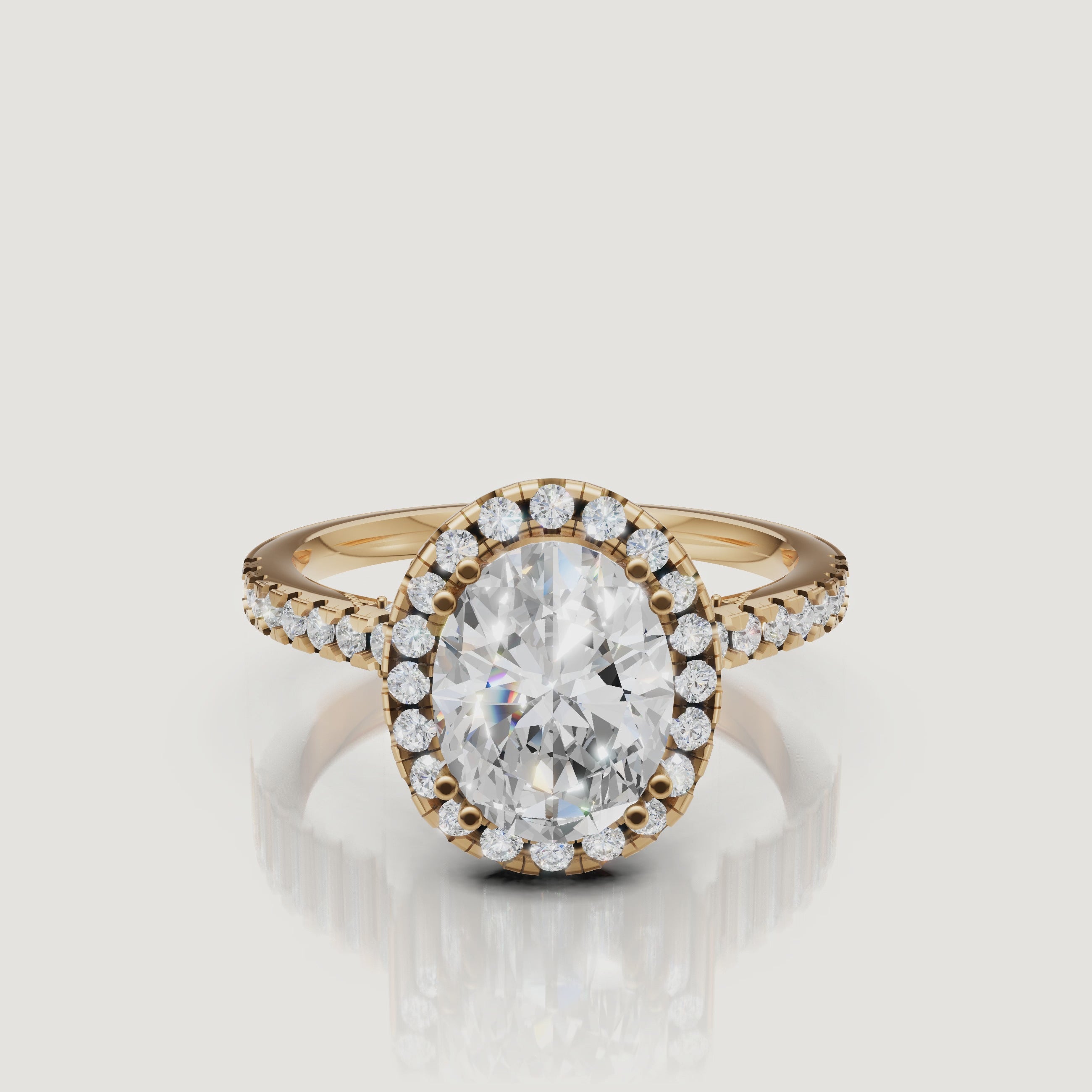 Video of oval cut lab grown diamond halo engagement ring in 14K yellow gold with pavé band by Raul Diamonds