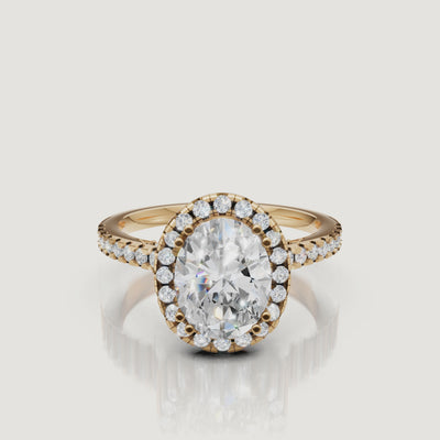 Video of oval cut lab grown diamond halo engagement ring in 14K yellow gold with pavé band by Raul Diamonds