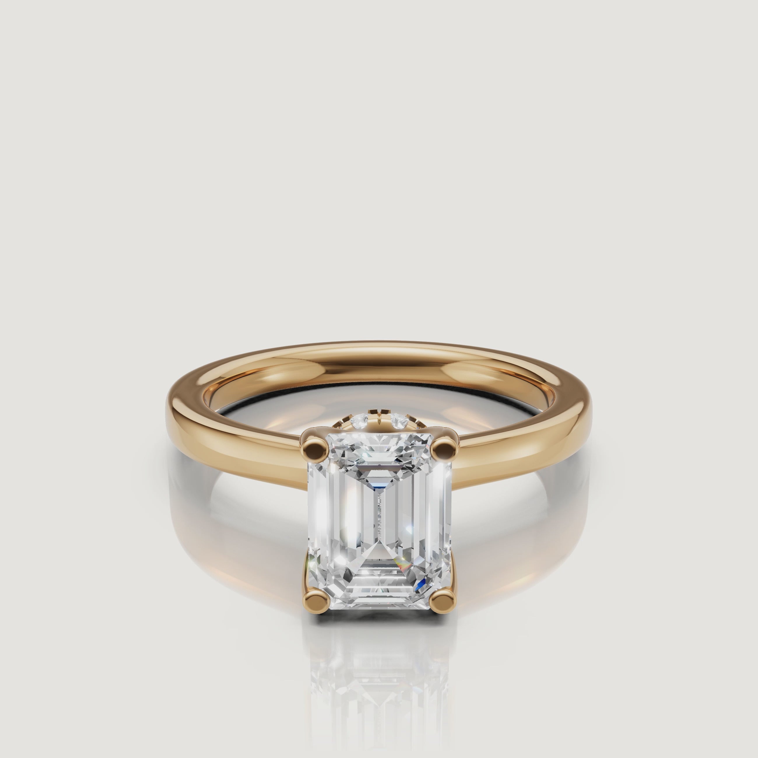video of emerald cut lab grown diamond solitaire engagement ring in 14k yellow gold with hidden halo