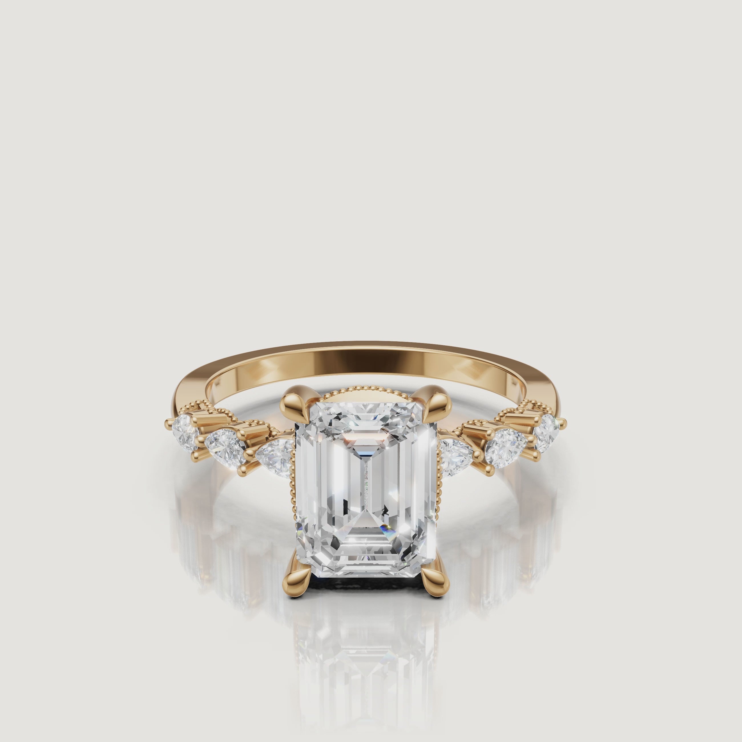 Video of emerald cut lab grown diamond engagement ring in 14K yellow gold with marquise side stones and hidden halo by Raul Diamonds