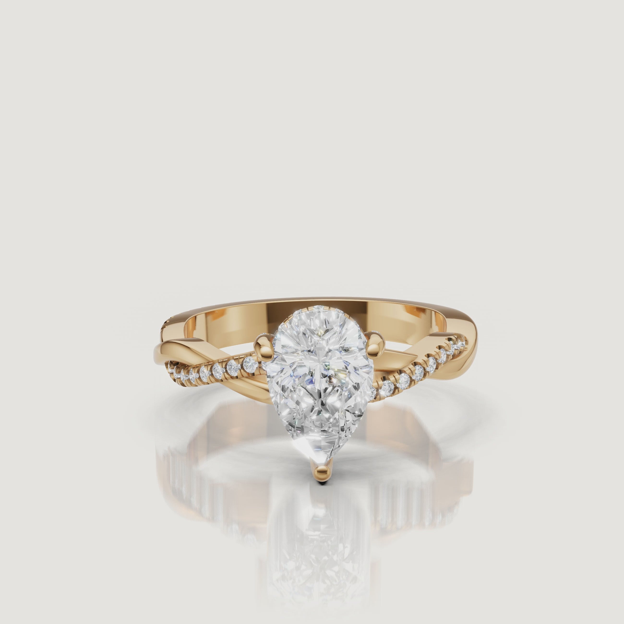 video of pear cut lab grown diamond bypass engagement ring in 14k gold with pavé diamond crossover shank and timeless brilliance