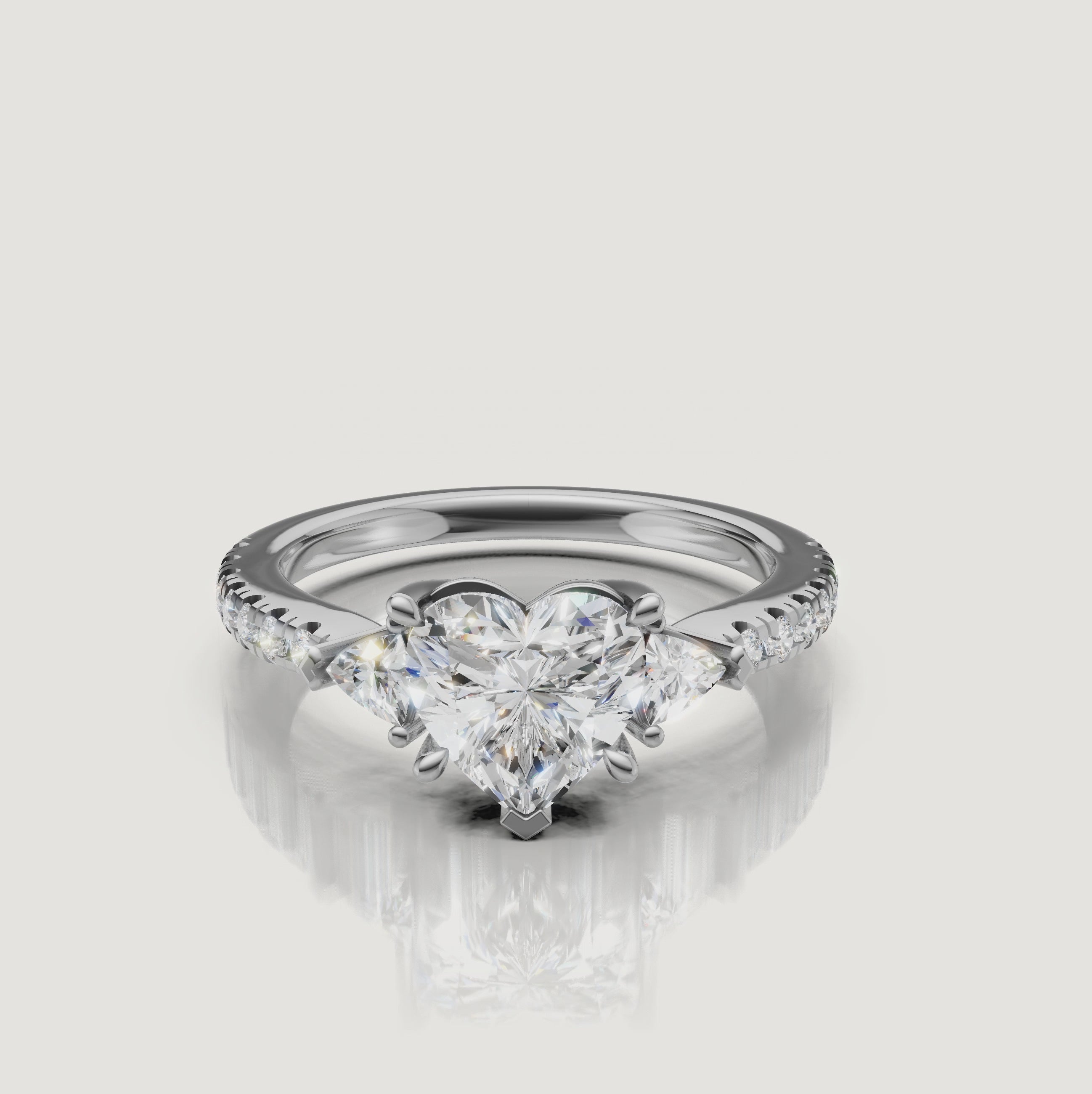 Lifestyle video of a model wearing the Rual Diamonds heart-shaped diamond ring, demonstrating the ring's fire and elegance in natural lighting