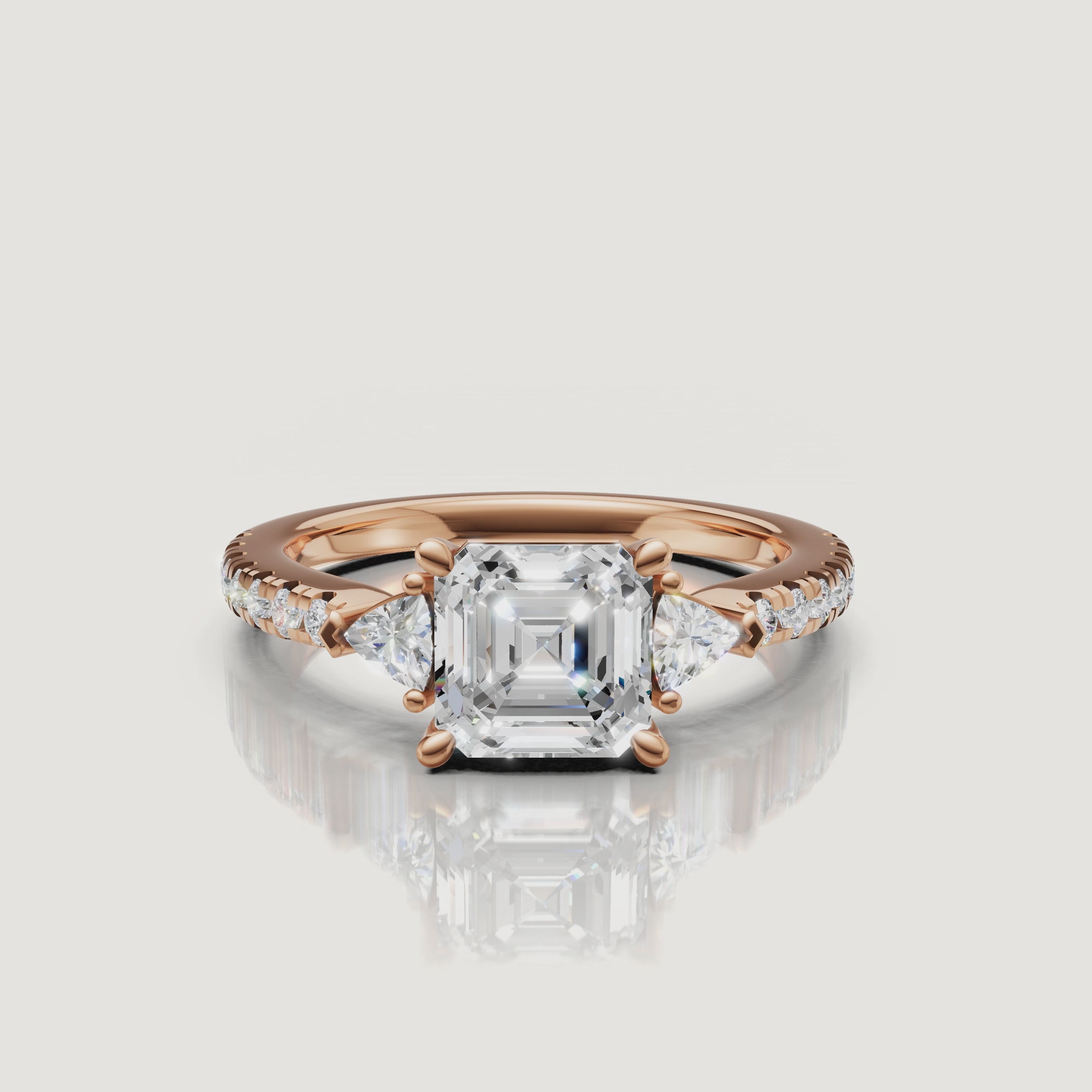 Cinematic video showing the sparkle and light performance of a Rual Diamonds three-stone asscher cut diamond ring with a shimmering pave band.