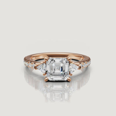 Cinematic video showing the sparkle and light performance of a Rual Diamonds three-stone asscher cut diamond ring with a shimmering pave band.