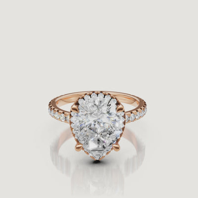 Macro sparkle test video of a rose gold Pear diamond ring featuring a delicate hidden halo and micro-pavé setting by Raul Diamonds