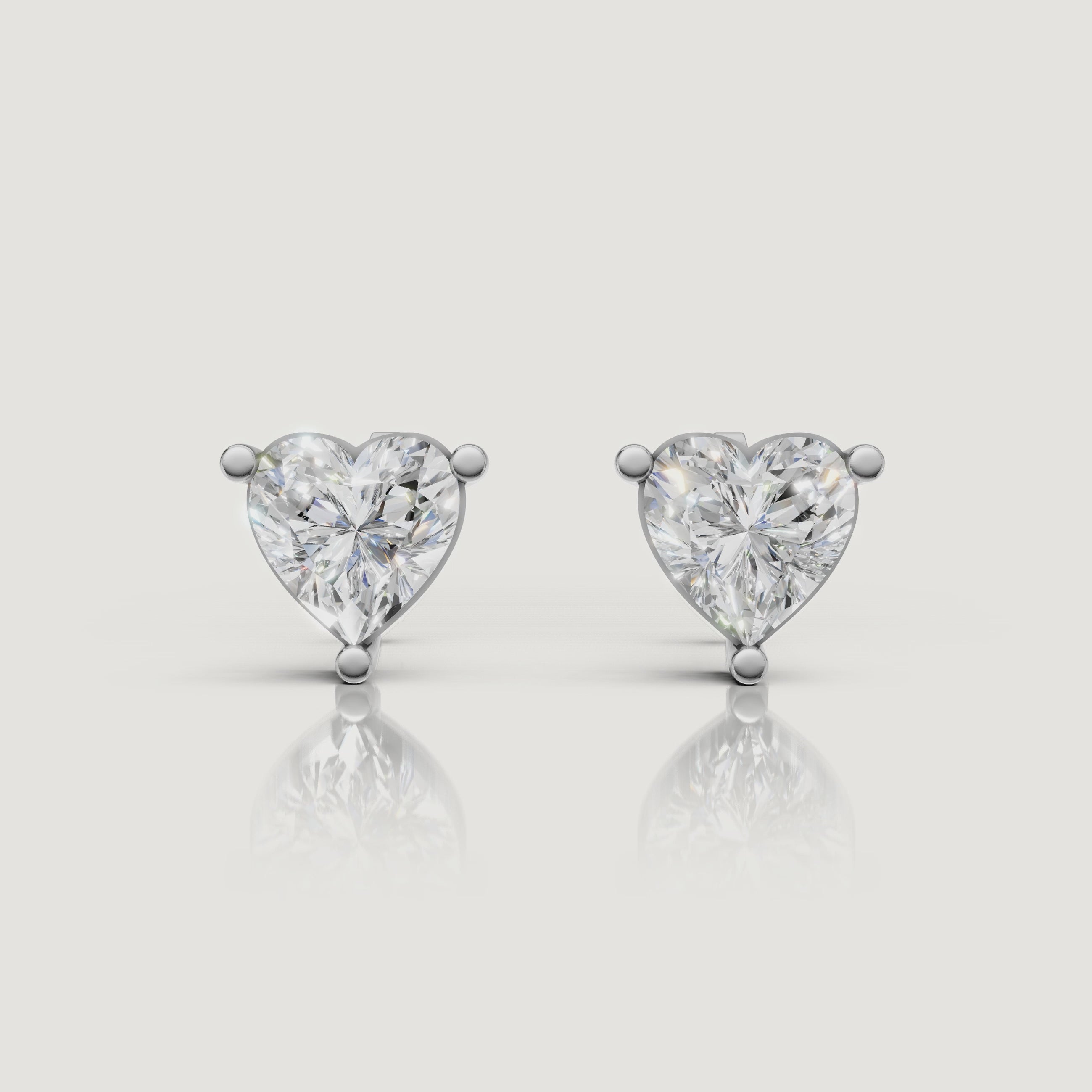 Rose gold heart shape diamond earrings luxury jewelry video by Raul Diamonds
