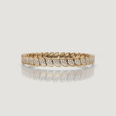 Cinematic yellow gold leaf diamond bracelet video by Raul Diamonds showcasing sparkling lab grown diamonds, marquise-inspired details, graceful wrist movement, and premium luxury jewelry close-ups