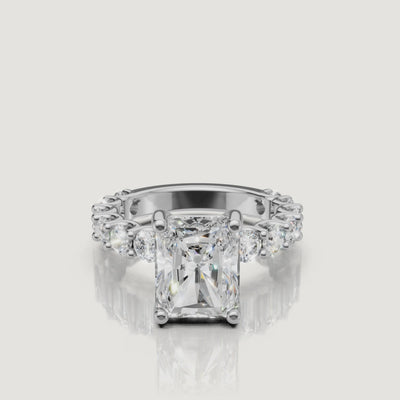 High-definition 360-degree profile view of a white gold radiant-cut diamond ring from Raul Diamonds, emphasizing the secure prong setting and brilliant side profile