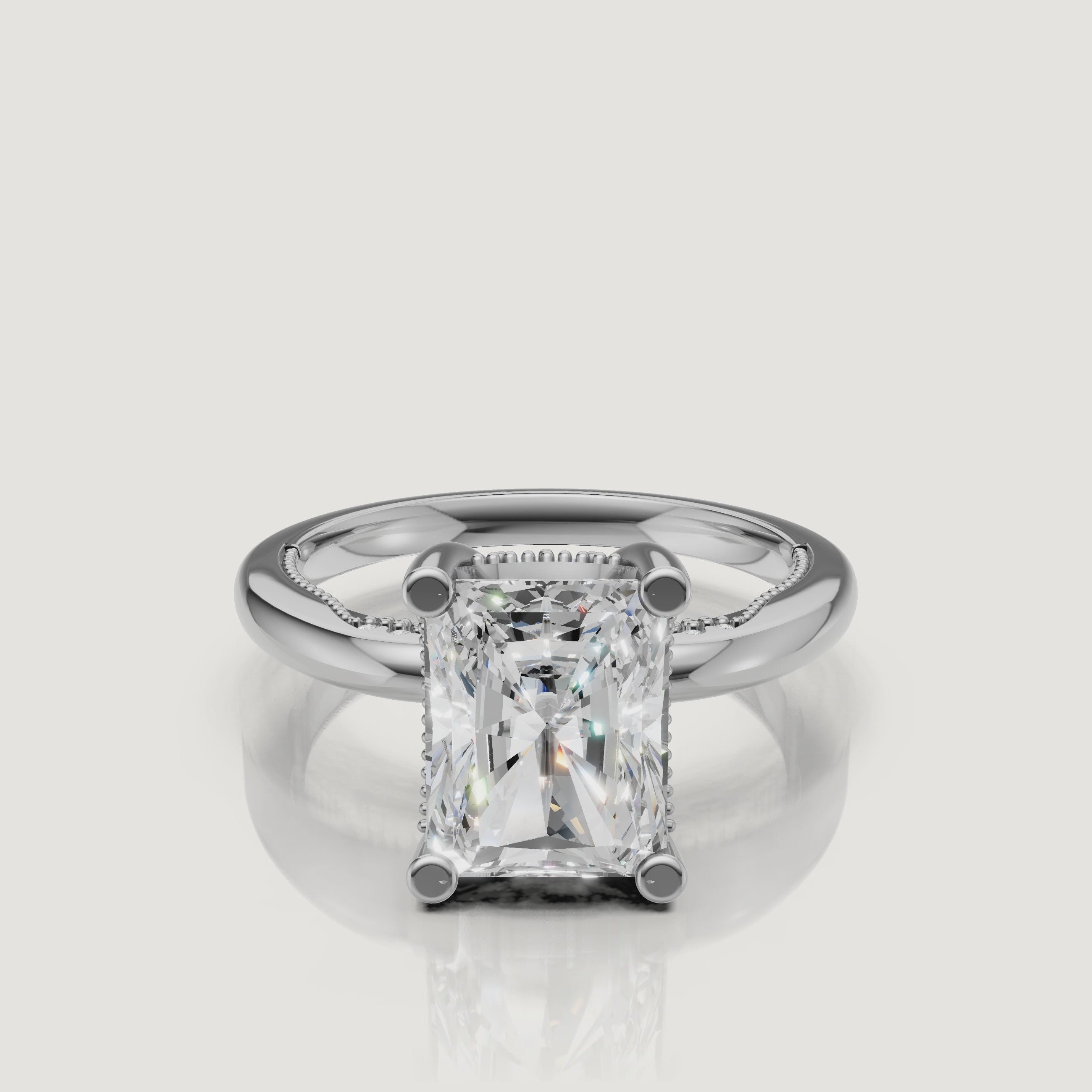 Macro video showcase of a white gold radiant cut solitaire ring by Raul Diamonds, displaying the trimmed corners and brilliant white fire.