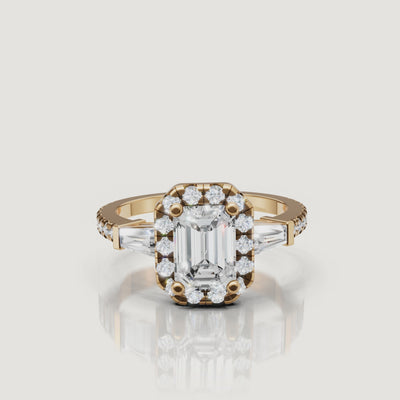 Yellow Gold Video Alt Text: Raul Diamonds emerald cut halo diamond engagement ring video in yellow gold