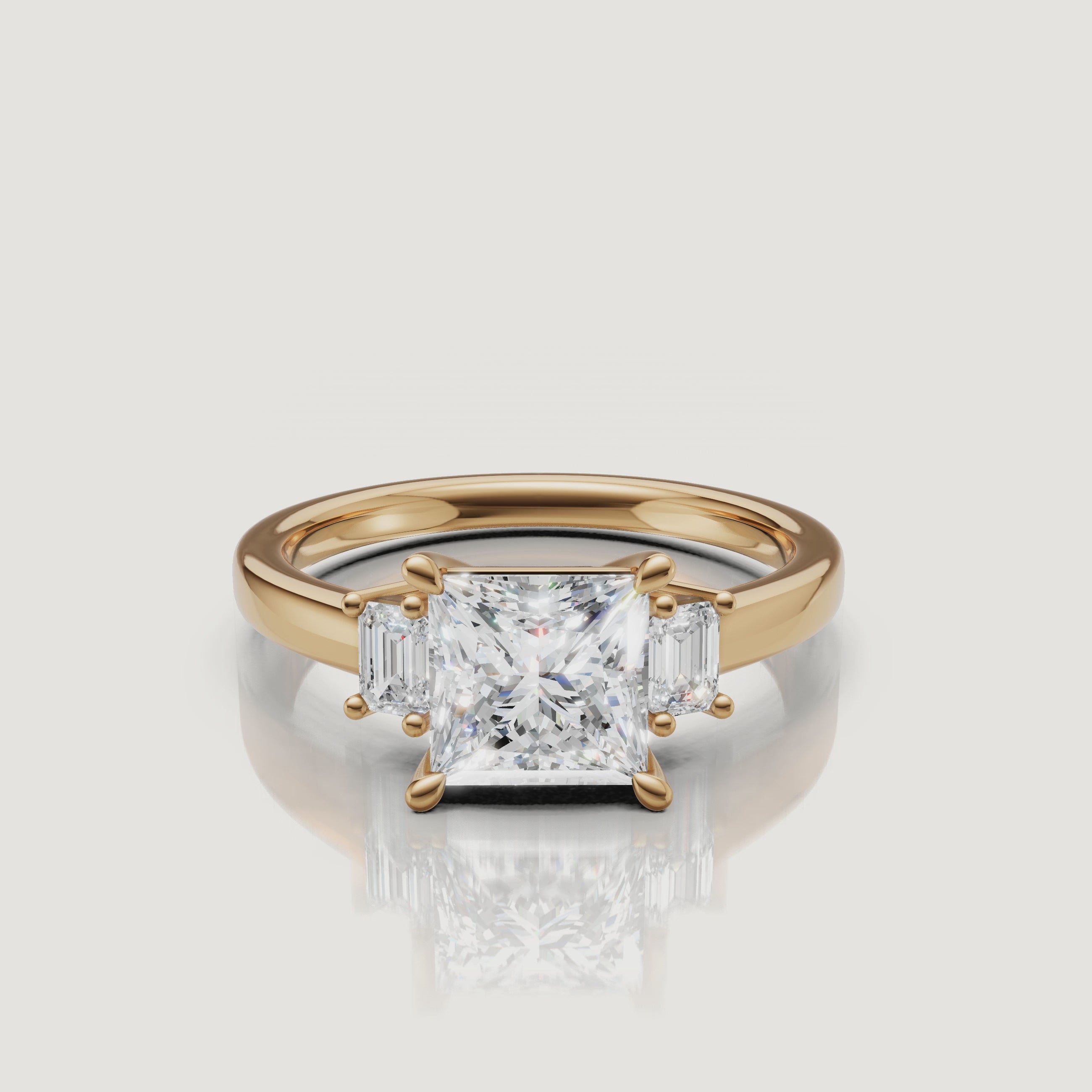 Cinematic 360-degree video showcase of the Raul Diamonds princess cut three-stone engagement ring in 18k yellow gold, highlighting the sparkle of the center diamond and the sleek emerald side stones.