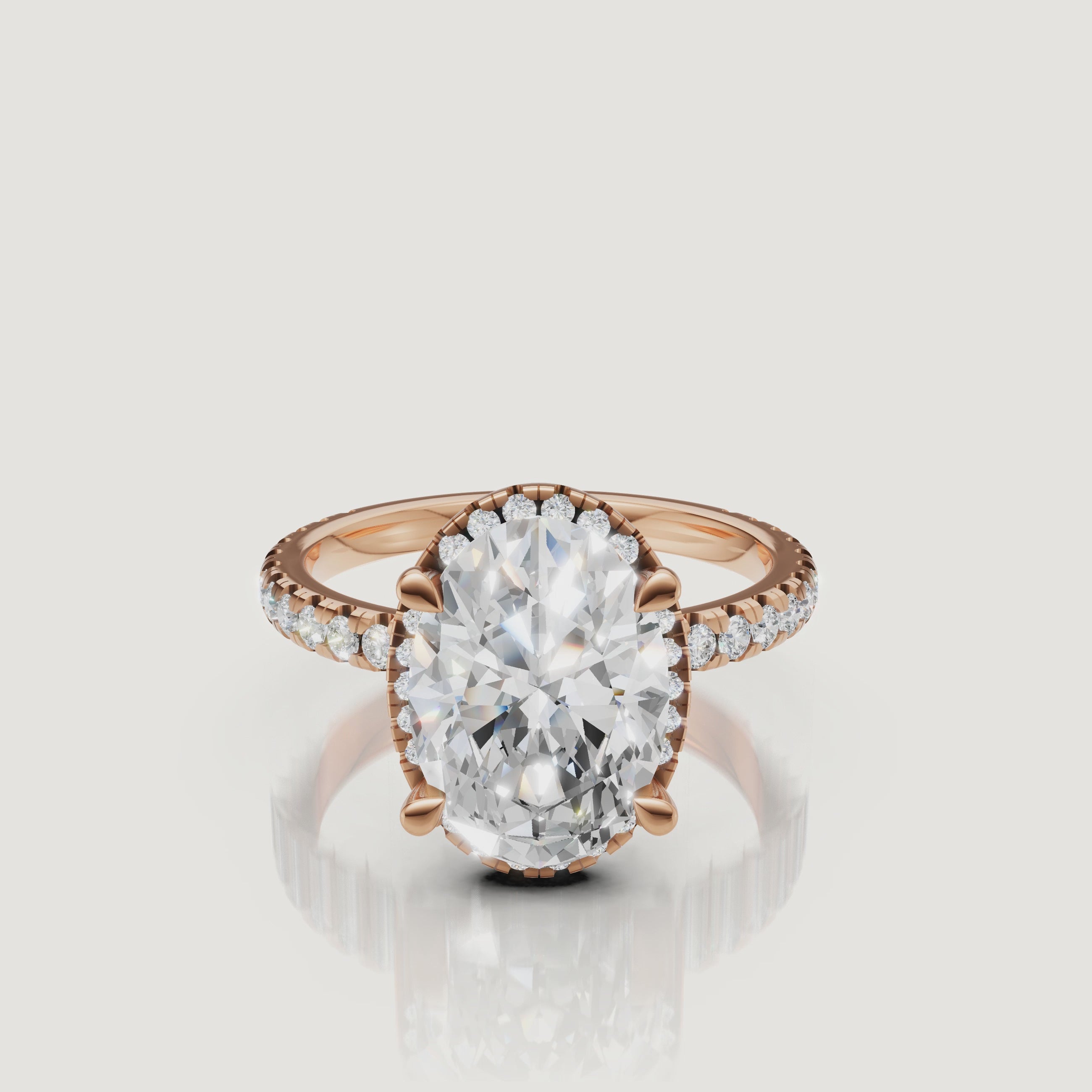 Macro video showing the light performance and sparkle of a rose gold Oval diamond ring with a secret hidden halo by Raul Diamonds