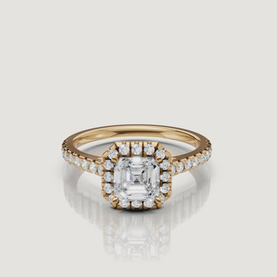 video of asscher cut lab grown diamond halo engagement ring with pavé band in 14k yellow gold