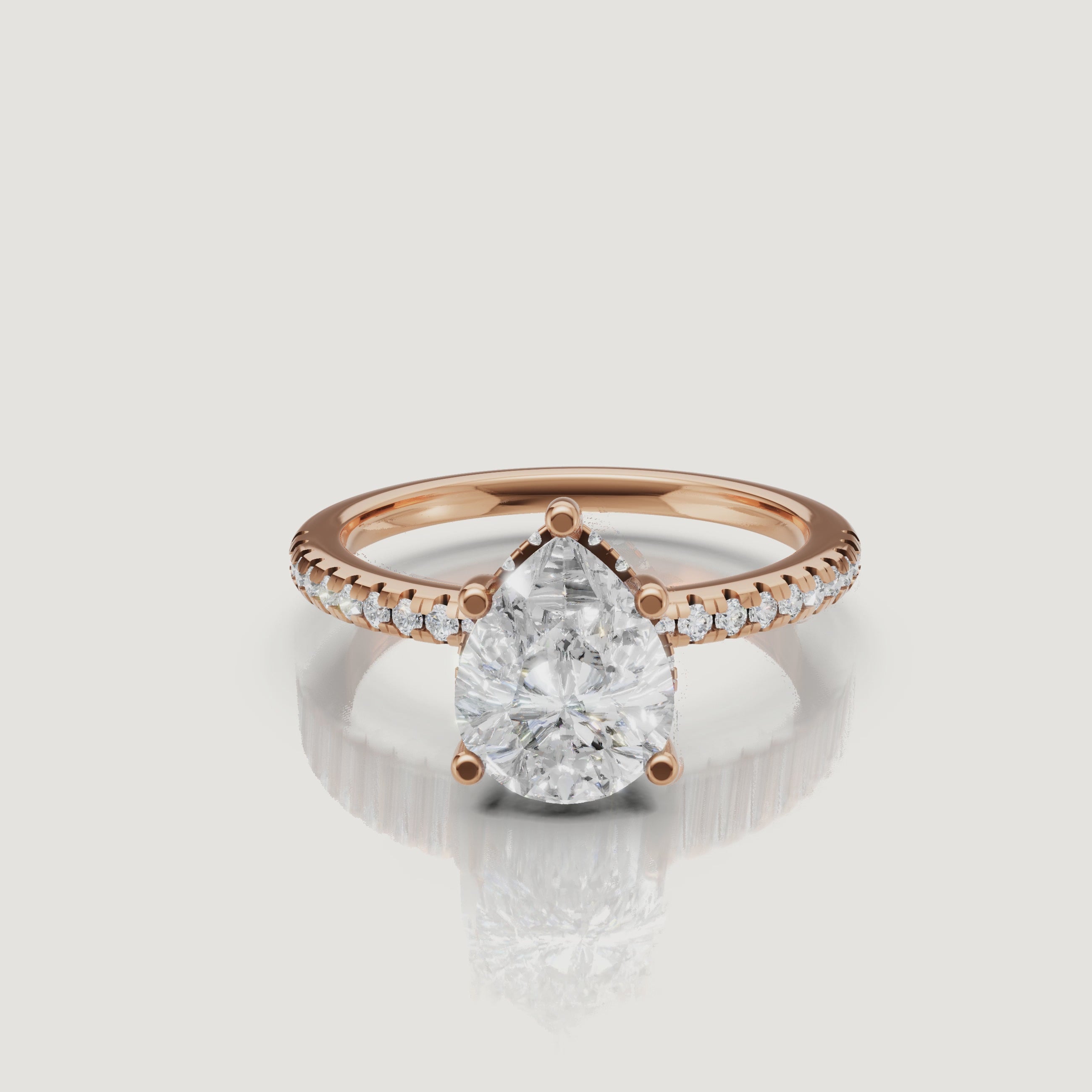 close up video of pear shaped lab diamond solitaire ring in 14k gold