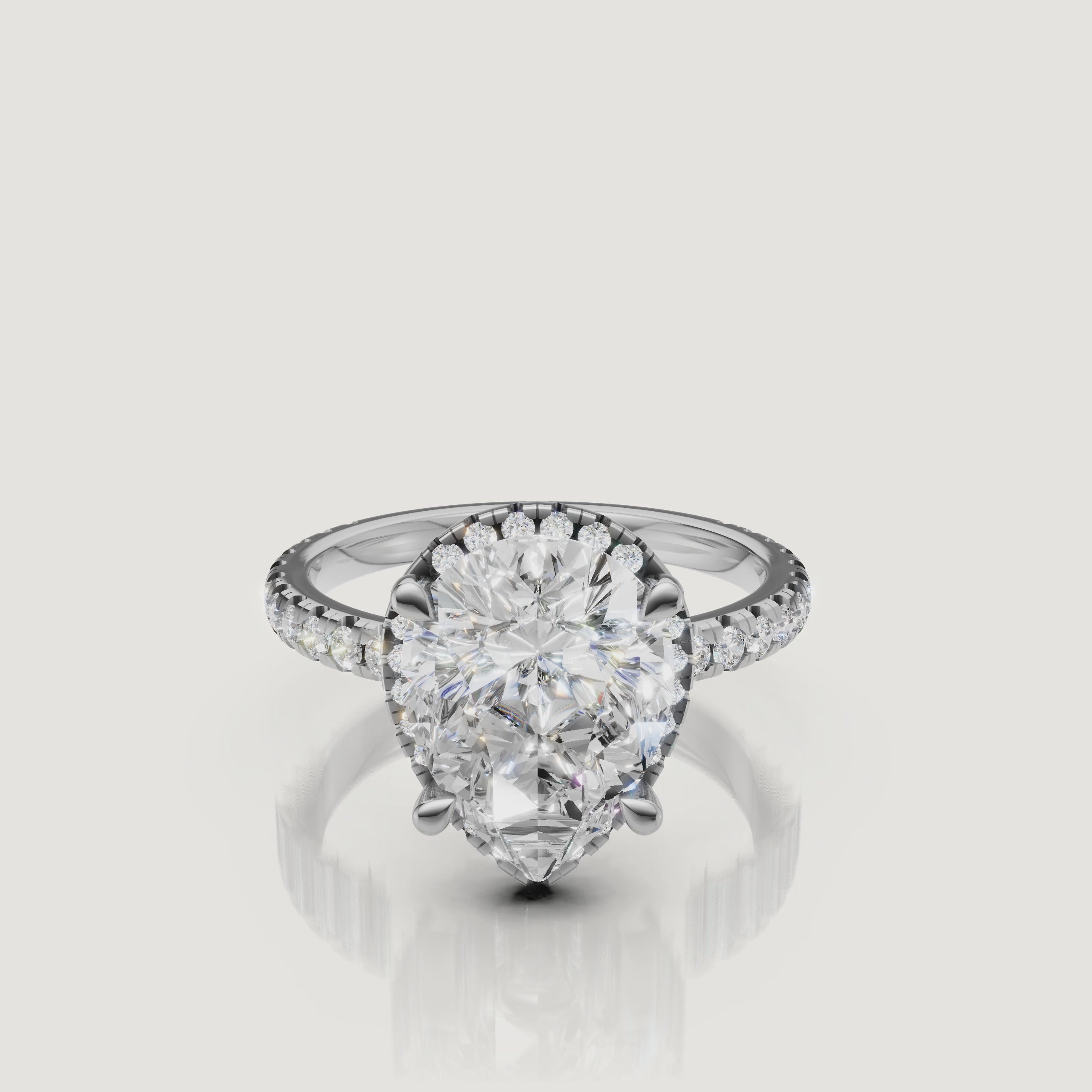 Lifestyle video of the Grace model wearing a Raul Diamonds white gold Pear engagement ring, showcasing the brilliant light performance of the teardrop stone