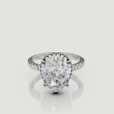 Lifestyle video of the Grace model wearing a Raul Diamonds white gold Pear engagement ring, showcasing the brilliant light performance of the teardrop stone