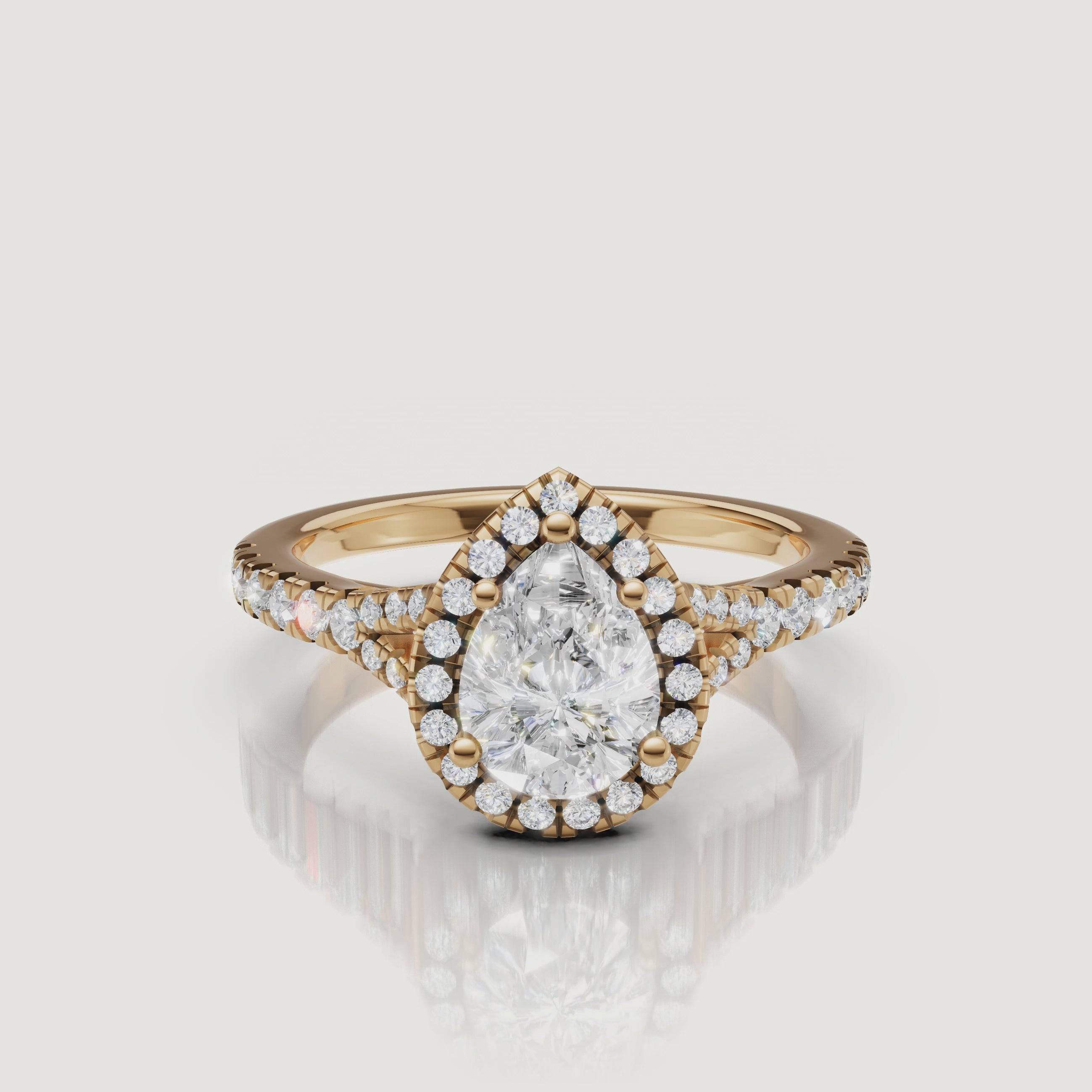 A 360-degree high-definition video of a Raul Diamonds pear-cut engagement ring in yellow gold, highlighting the brilliance of the teardrop center stone and the split shank