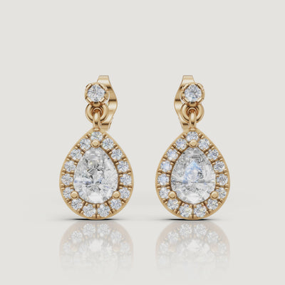 Yellow gold pear halo diamond drop earrings luxury jewelry video by Raul Diamonds
