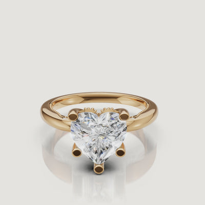 Cinematic video of a Raul Diamonds heart-cut ring in yellow gold, featuring a slow rotation to show the perfect symmetry and warm gold glow.