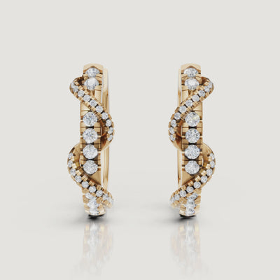 Yellow gold diamond swirl hoop earrings cinematic jewelry video by Raul Diamonds