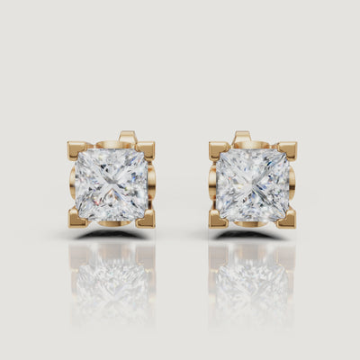 Yellow gold princess cut diamond stud earrings video with brilliant solitaire sparkle by Raul Diamonds
