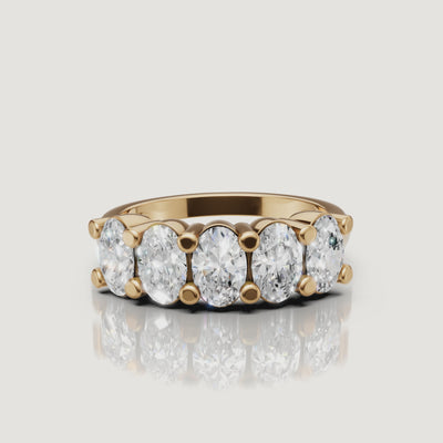 rotating view of oval lab grown diamond five stone anniversary ring in polished gold