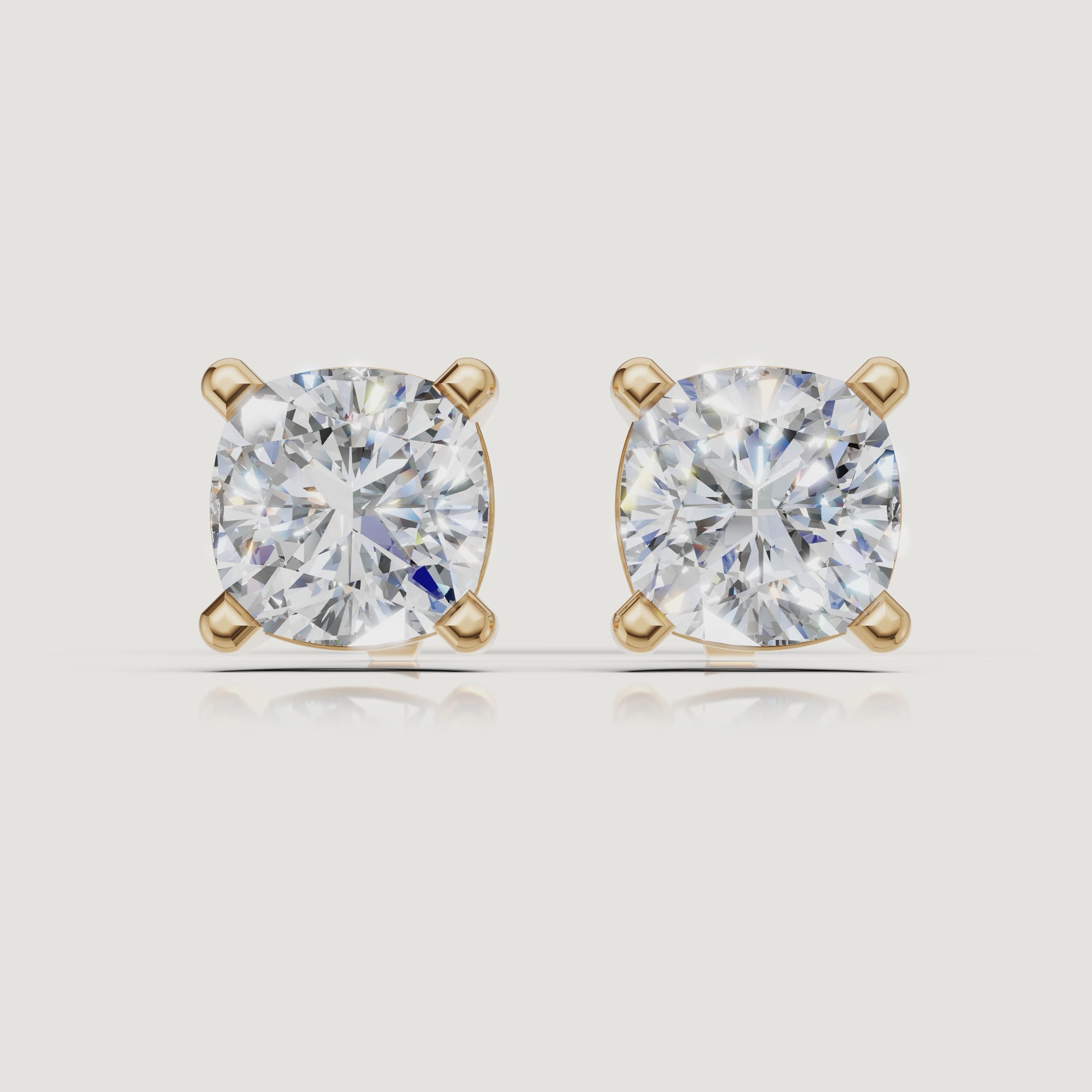 Yellow gold cushion cut diamond stud earrings cinematic jewelry video by Raul Diamonds