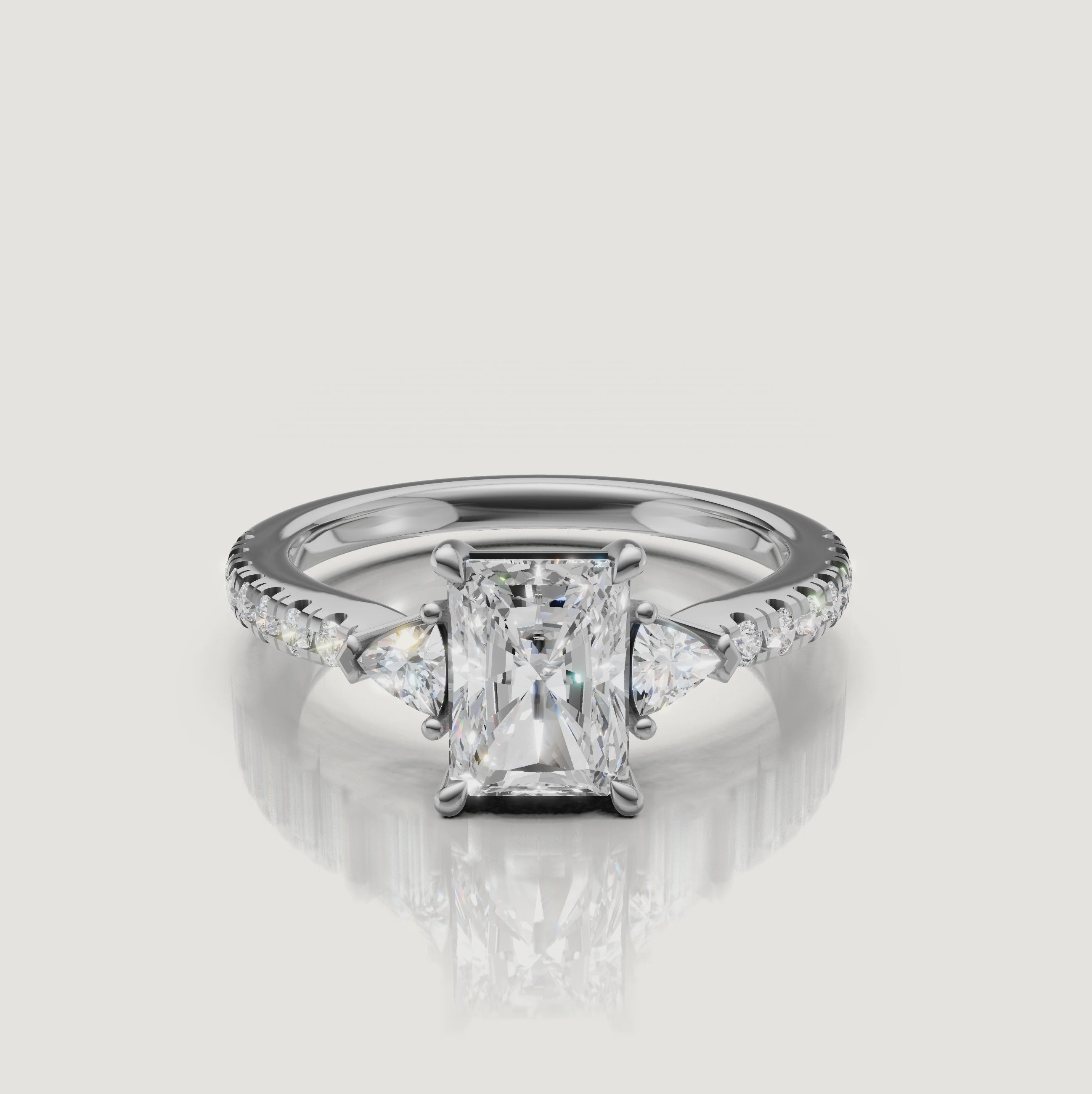 High-definition video of a Rual Diamonds white gold radiant-cut engagement ring, highlighting the crisp 'crushed ice' brilliance of the center stone and diamond-encrusted band