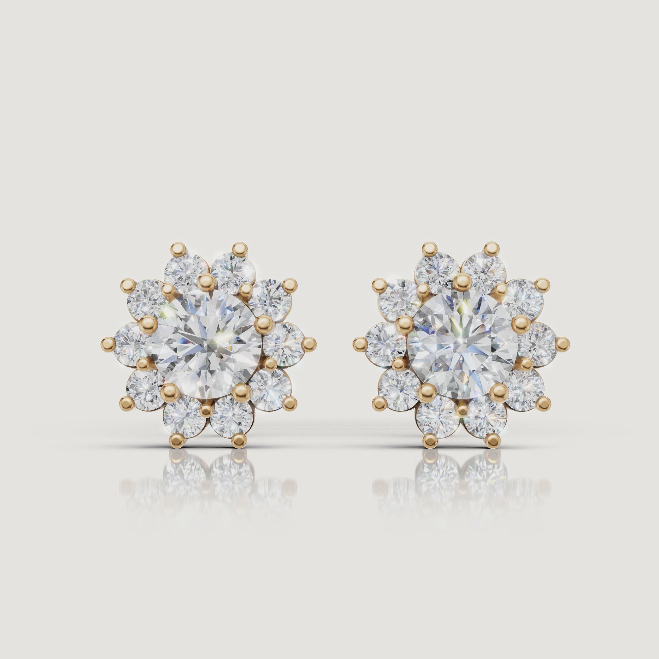 Yellow gold floral halo diamond earrings cinematic jewelry video by Raul Diamonds