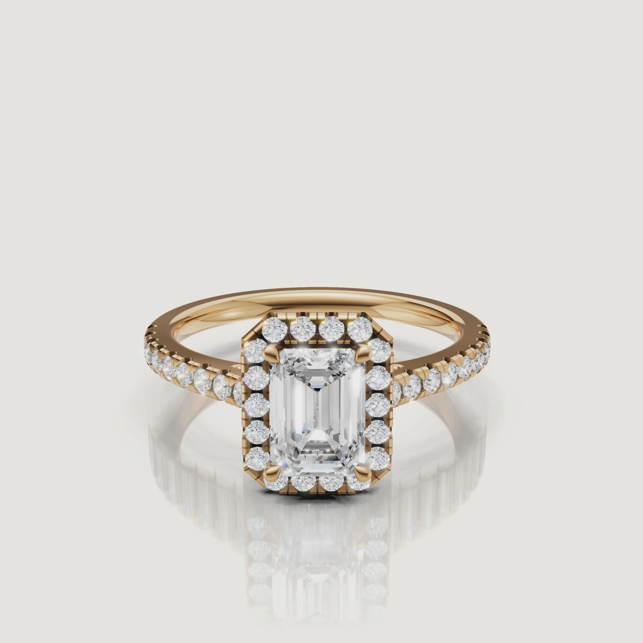 video of emerald cut lab grown diamond halo engagement ring with pavé band in 14k yellow gold