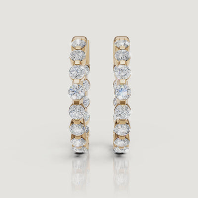 Yellow gold round diamond hoop earrings video with brilliant lab grown diamond sparkle and elegant luxury styling by Raul Diamonds